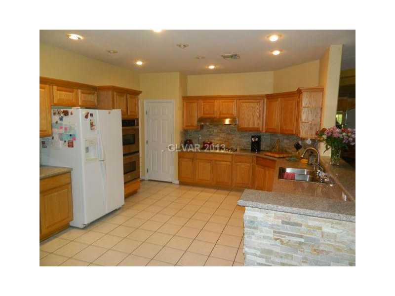 1024 Norellat Road Henderson, NV 89011 - Photo 13 of 35 Kitchen. KITCHEN WITH DOUBLE OVENS AND PANTRY AREA
