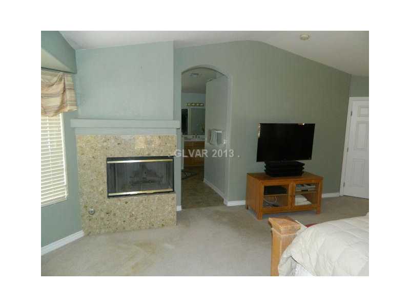 1024 Norellat Road Henderson, NV 89011 - Photo 22 of 35 Master Bedroom. GAS FIREPLACE IN THE MASTER SUITE