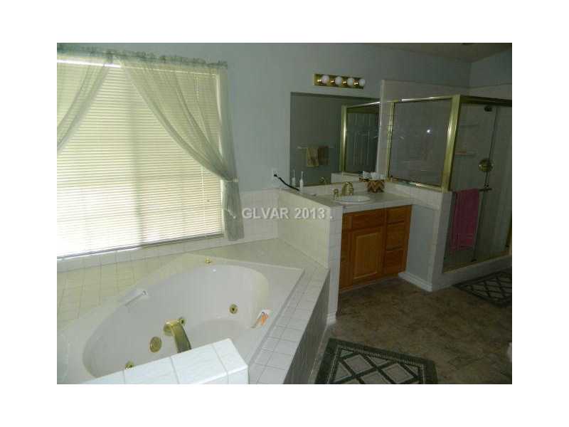 1024 Norellat Road Henderson, NV 89011 - Photo 26 of 35 Master Bath/Spa. SEPARATE STALL SHOWER DUAL SINKS AND JETTED TUB IN THE MASTER BATHROOM