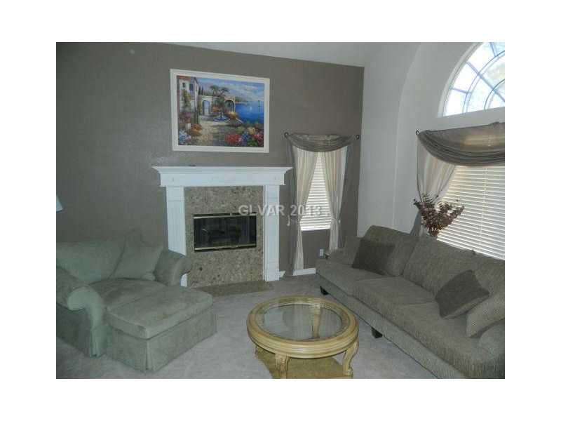 1024 Norellat Road Henderson, NV 89011 - Photo 4 of 35 Living Room. FORMAL LIVING ROOM WITH COZY GAS FIREPLACE