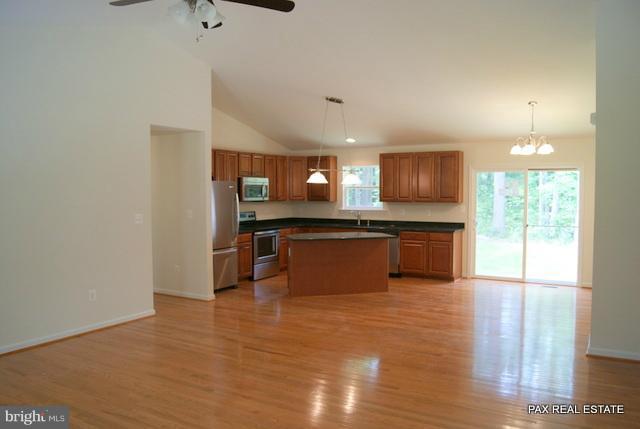 4430 Solomons Island Road Huntingtown, MD 20639 - Photo 11 of 17 a large kitchen with a lot of counter space and stainless steel appliances