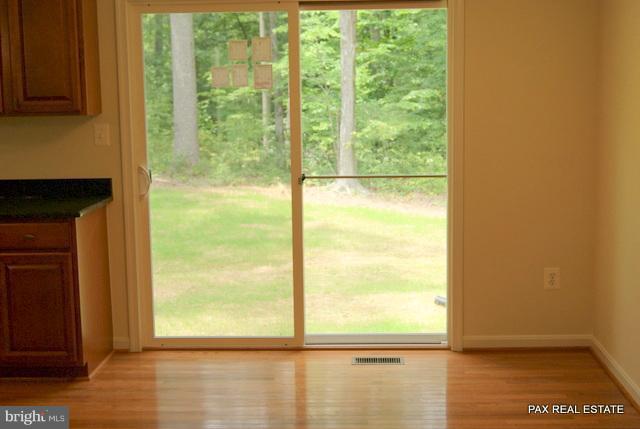 4430 Solomons Island Road Huntingtown, MD 20639 - Photo 15 of 17 a view of a glass door with a lake view