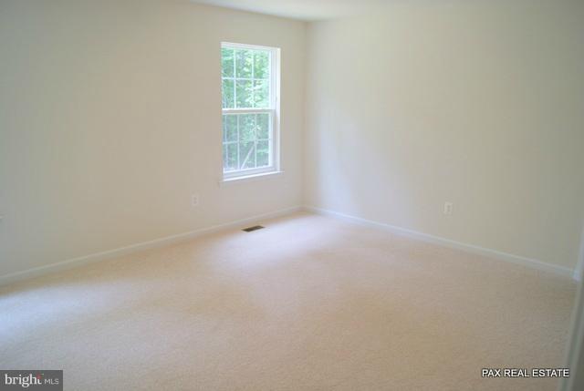4430 Solomons Island Road Huntingtown, MD 20639 - Photo 3 of 17 an empty room with a window