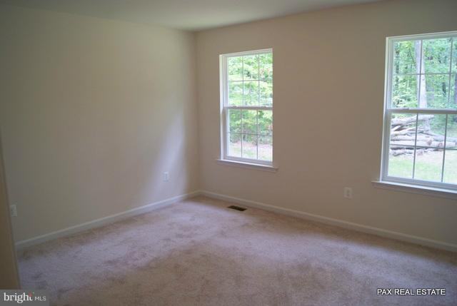 4430 Solomons Island Road Huntingtown, MD 20639 - Photo 7 of 17 an empty room with a window