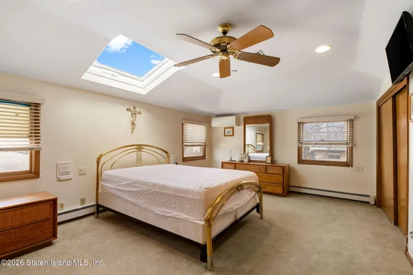 a bedroom with a bed and a desk