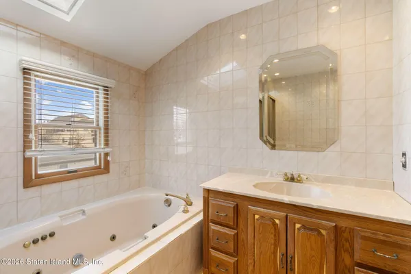 a bathroom with a bathtub and sink