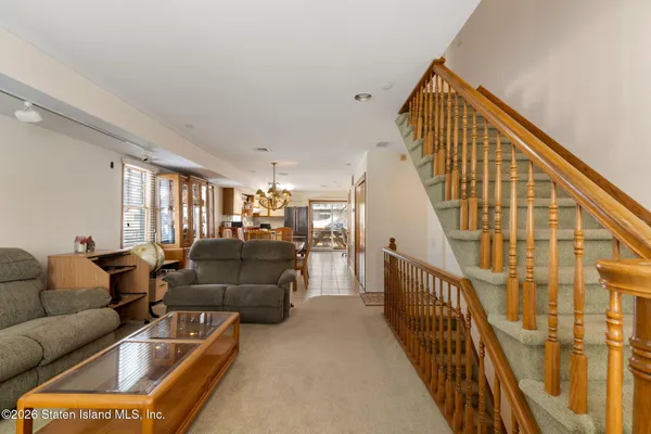 a dining room with furniture window and wooden floor