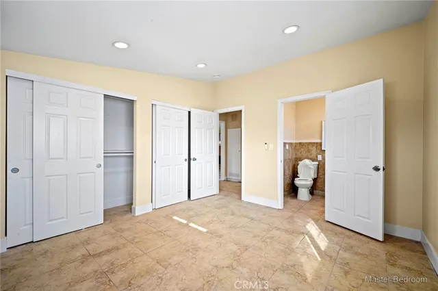 a view of a bedroom with closet area