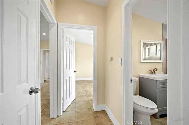 a bathroom with a toilet a sink and bathtub