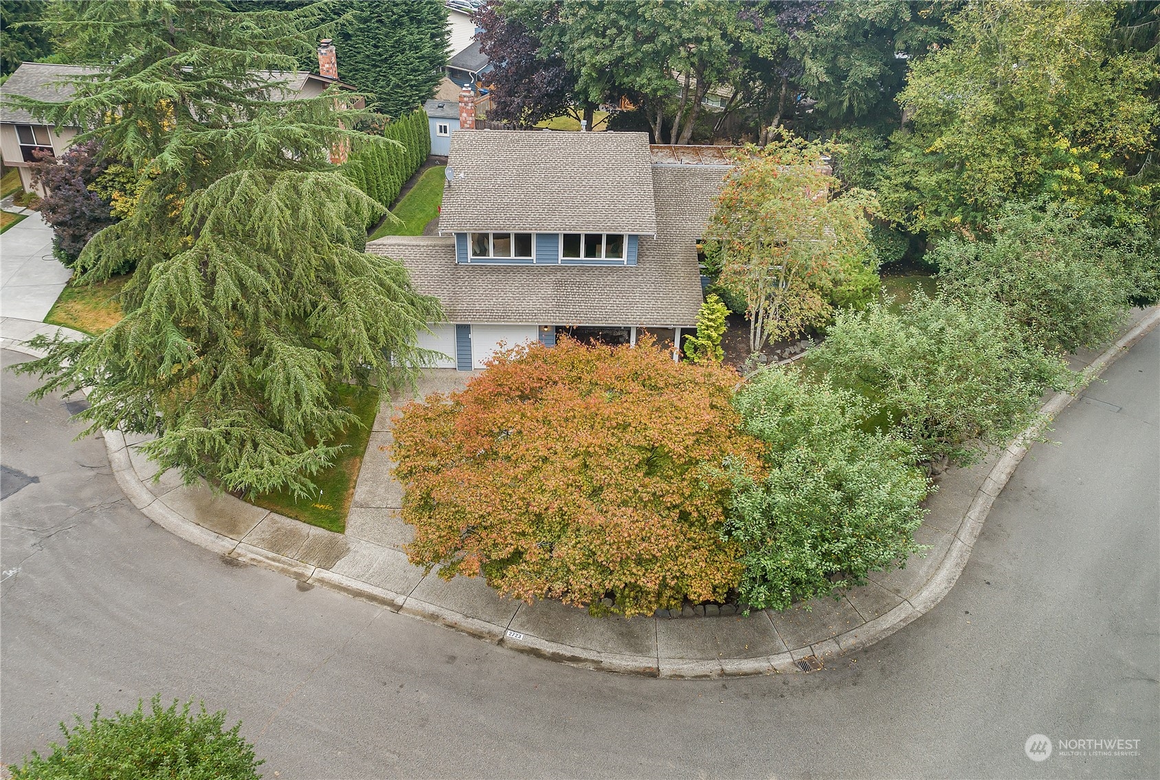 2723 166th Street Southeast Bothell, WA 98012 - Photo 1 of 31 a view of a garden with a house