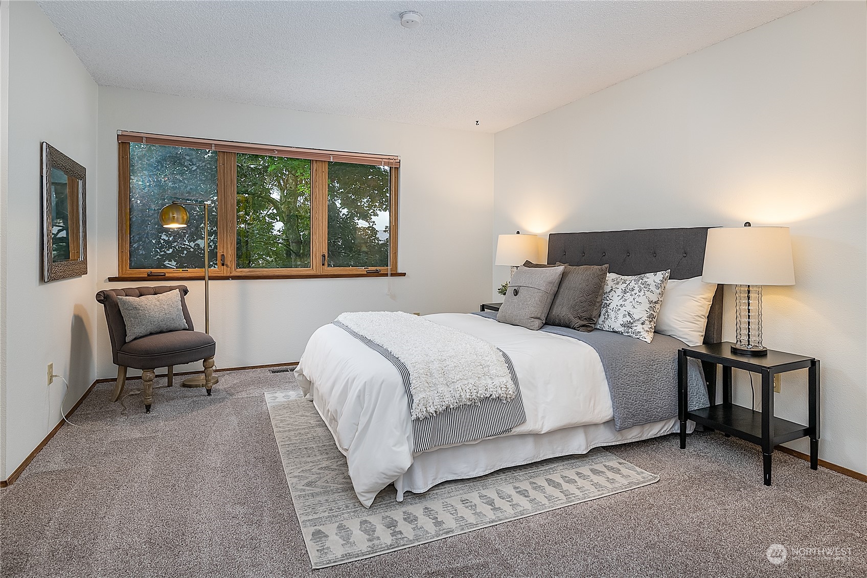2723 166th Street Southeast Bothell, WA 98012 - Photo 15 of 31 a bedroom with a bed and a large window