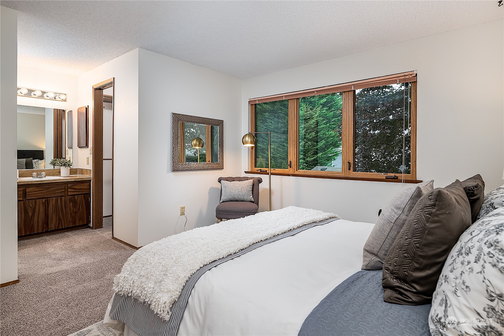 2723 166th Street Southeast Bothell, WA 98012 - Photo 16 of 31 a bedroom with a bed a dresser and a large window