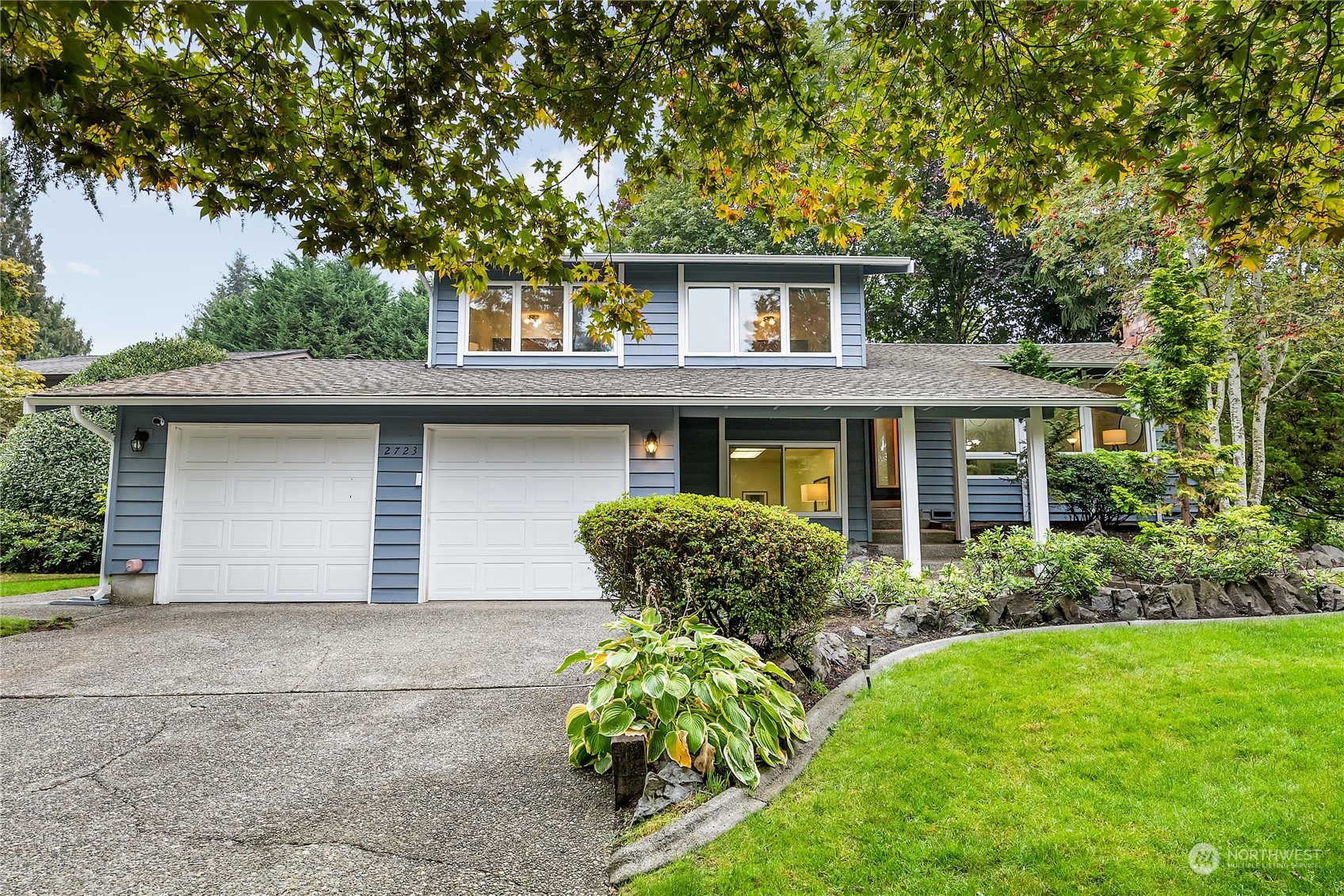 2723 166th Street Southeast Bothell, WA 98012 - Photo 2 of 31 a front view of a house with garden
