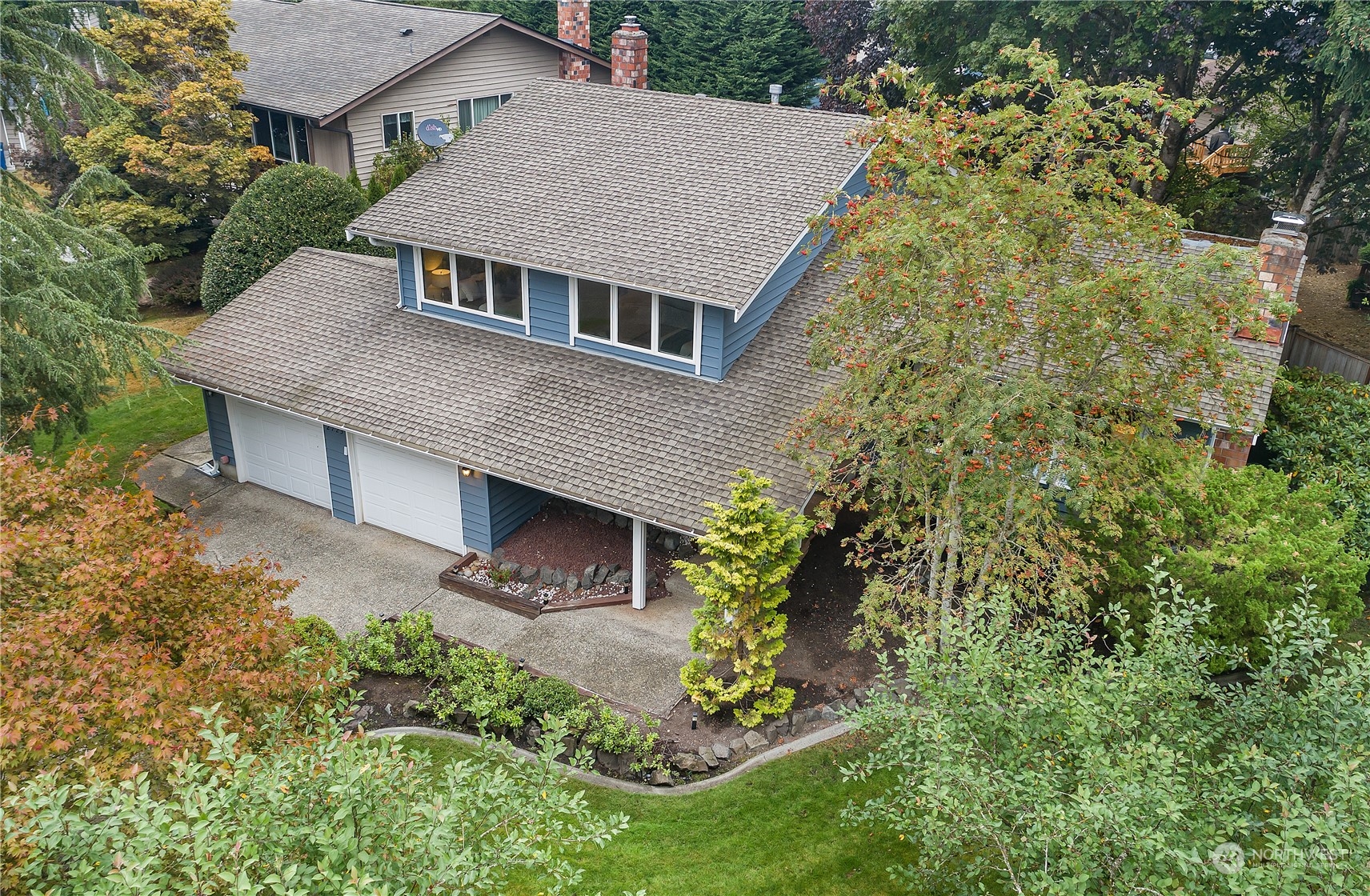 2723 166th Street Southeast Bothell, WA 98012 - Photo 28 of 31 an aerial view of a house with a yard and potted plants