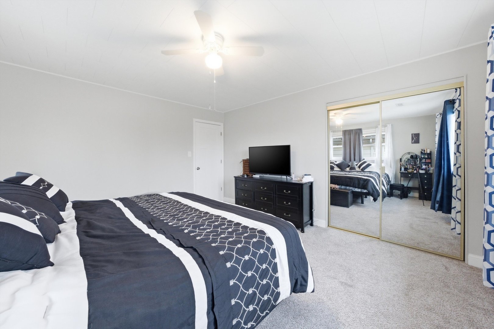 8945 South Corcoran Road Hometown, IL 60456 - Photo 17 of 24 a bedroom with a bed and a television