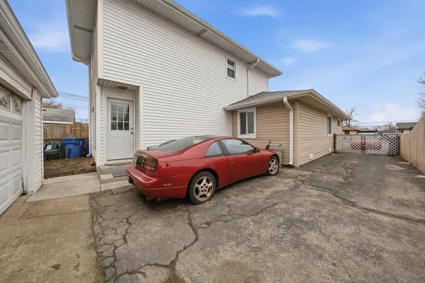 a view of a car in front of a house