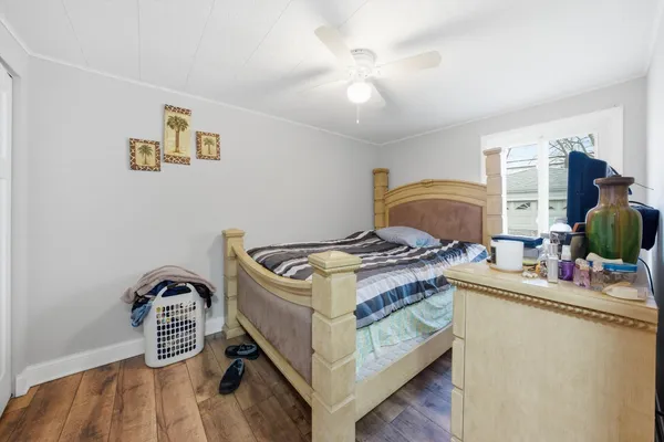 a kitchen that has a stove and a wooden floor