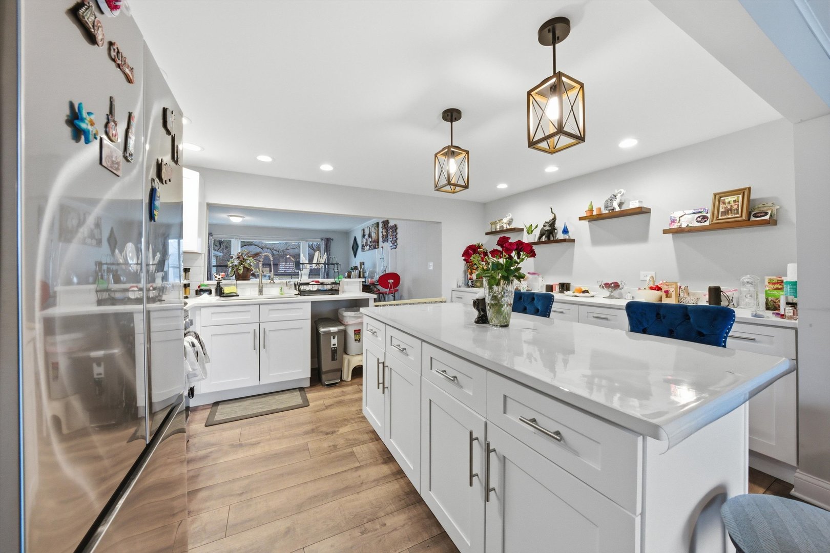 8945 South Corcoran Road Hometown, IL 60456 - Photo 8 of 24 a kitchen with white cabinets and chandelier