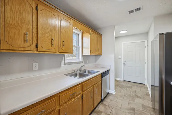 a kitchen with a sink and cabinets