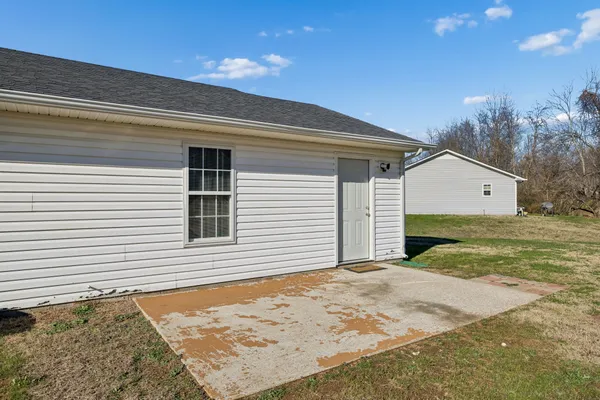 a view of a backyard of the house