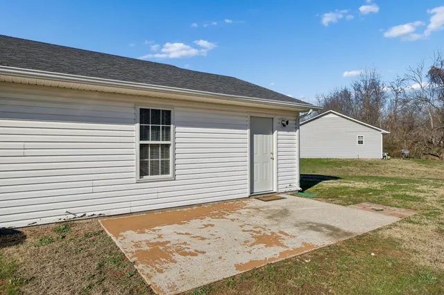 a view of a backyard of the house