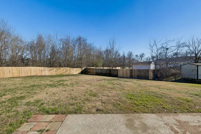 a backyard of a house with trees