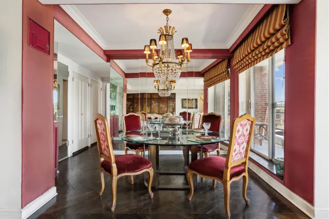 a kitchen with a refrigerator a microwave and cabinets