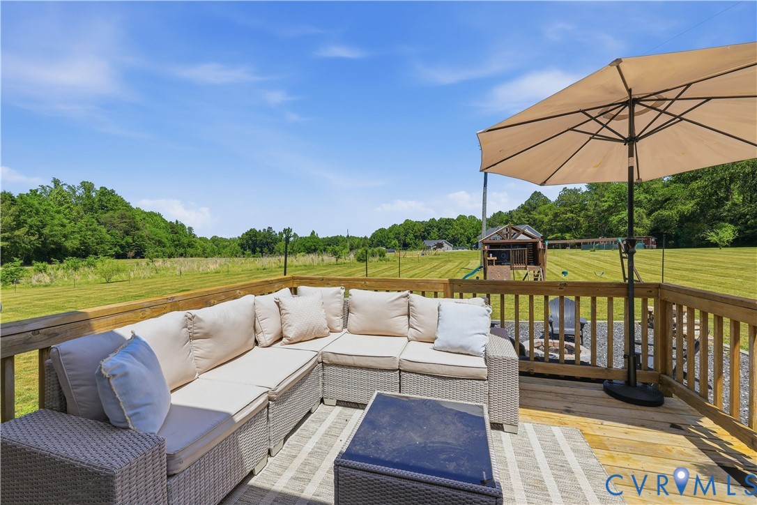 235 Stoney Point Road Cumberland, VA 23040 - Photo 12 of 35 a view of a patio with couches and pool