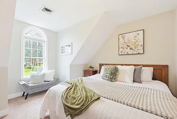 a bedroom with a bed and a cabinets