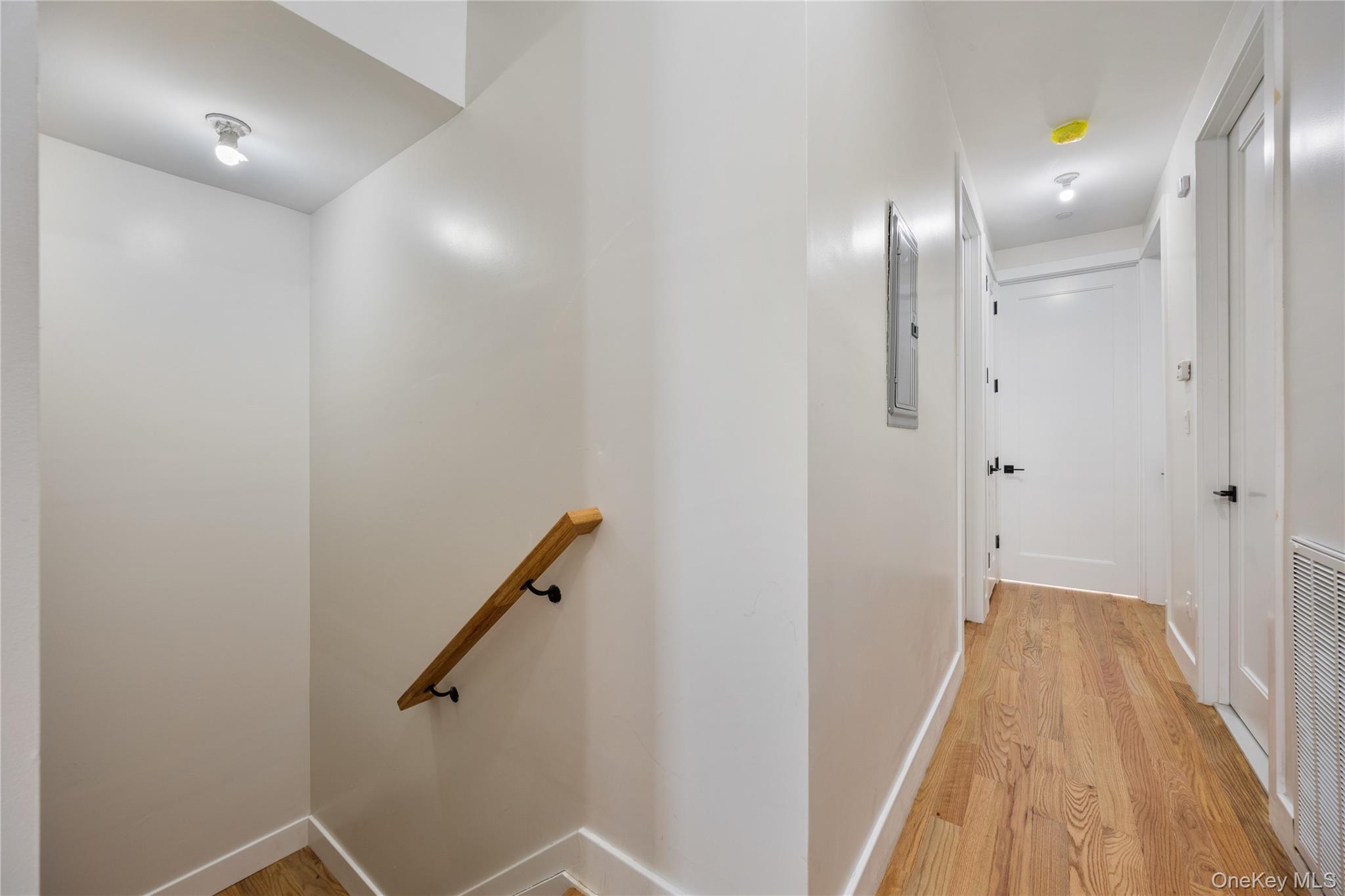 19 Lazer Court, Unit 102 Spring Valley, NY 10977 - Photo 24 of 31 a view of a hallway with wooden floor