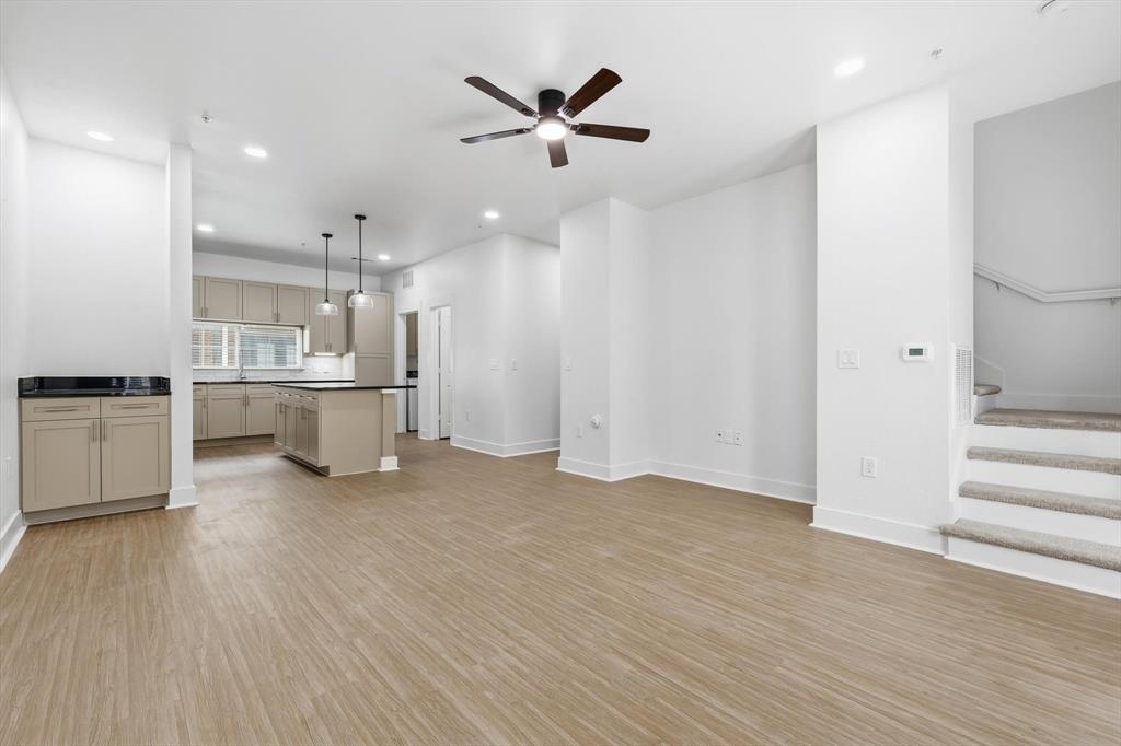 4110 Fairmount Street, Unit 1011 Dallas, TX 75219 - Photo 18 of 35 a view of an empty room with a kitchen