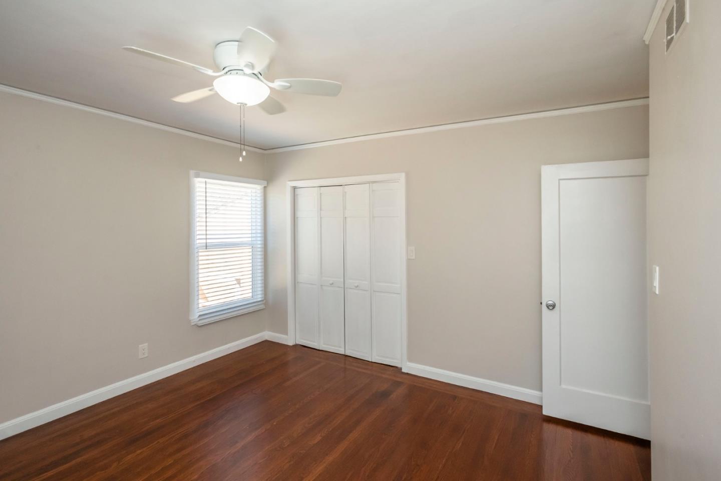 540 Sylvan Avenue San Mateo, CA 94403 - Photo 17 of 23 an empty room with wooden floor and windows