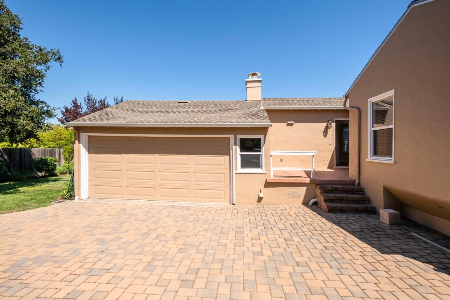 540 Sylvan Avenue San Mateo, CA 94403 - Photo 20 of 23 a front view of a house with a yard