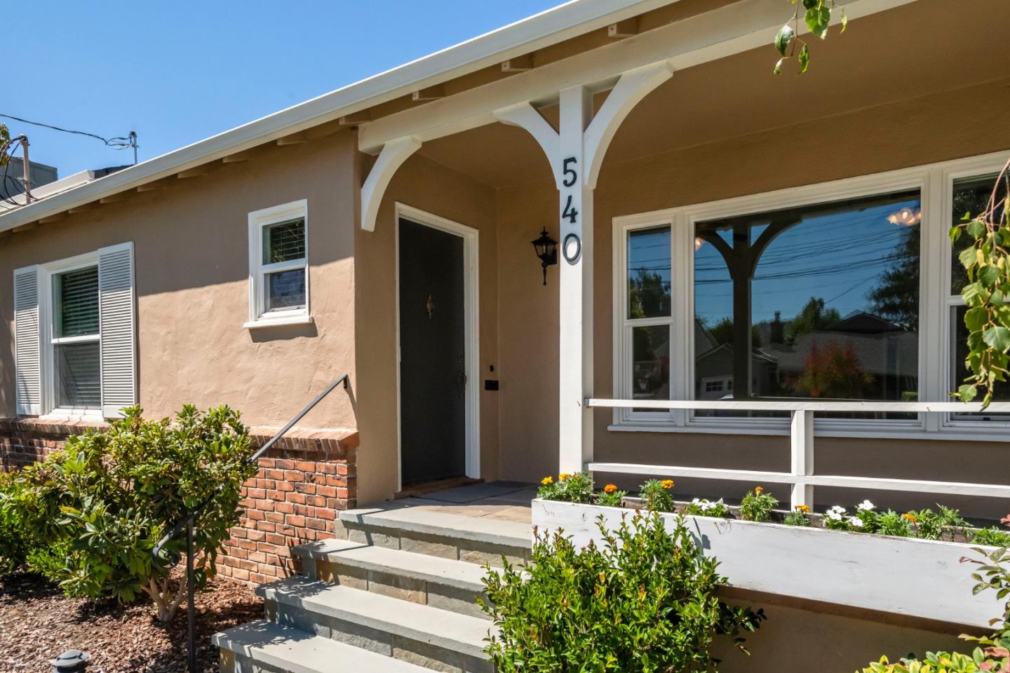 540 Sylvan Avenue San Mateo, CA 94403 - Photo 2 of 23 a front view of a house with a garden