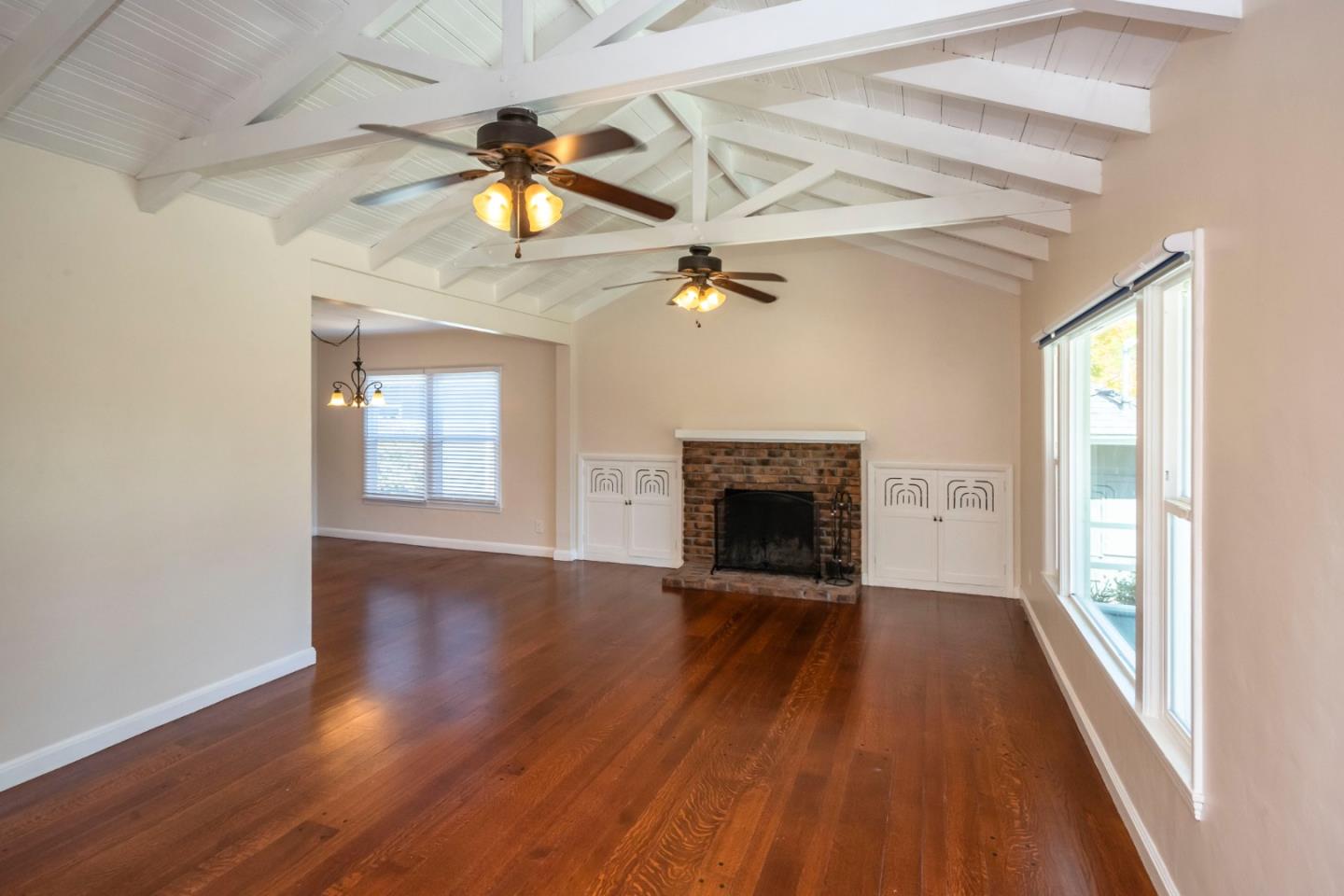 540 Sylvan Avenue San Mateo, CA 94403 - Photo 5 of 23 wooden floor in an empty room with a fireplace