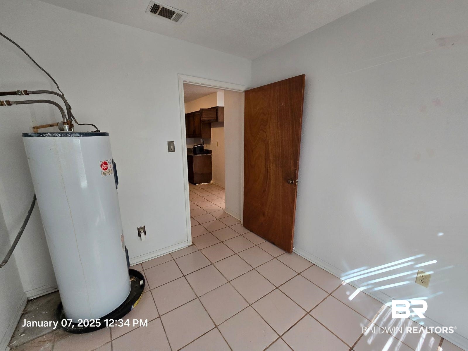 154 Byrd Road Monroeville, AL 36460 - Photo 11 of 26 Utility room featuring gas water heater