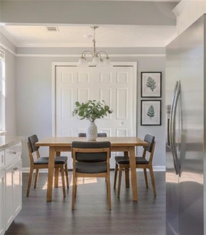 53 Washington Drive Forsyth, GA 31029 - Photo 14 of 19 a view of a dining room with furniture and wooden floor