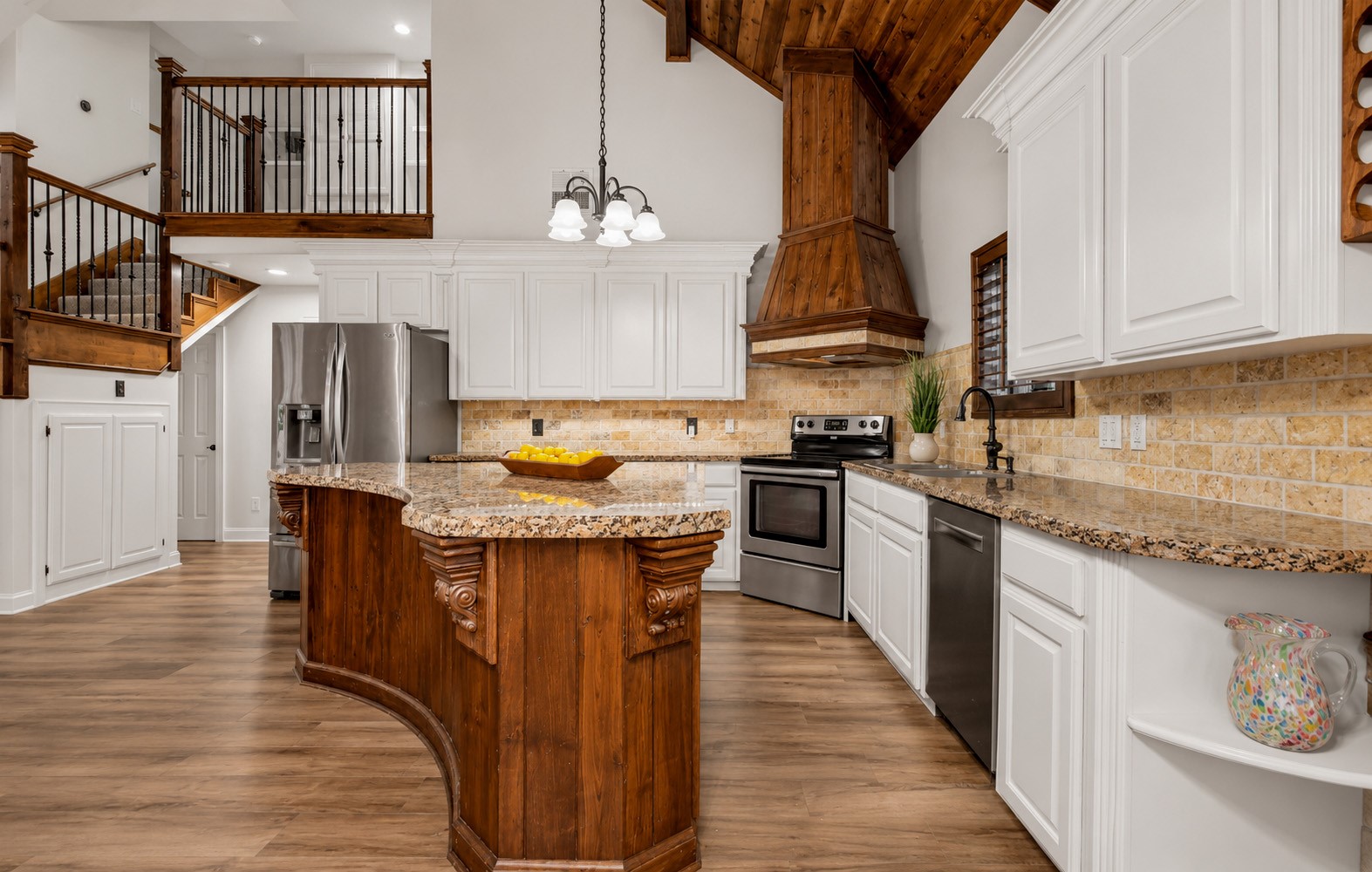312 Springwood Drive Conroe, TX 77385 - Photo 21 of 50 You will fall in love with the unique architecture and wood work that flows through the kitchen and into the entire living area.