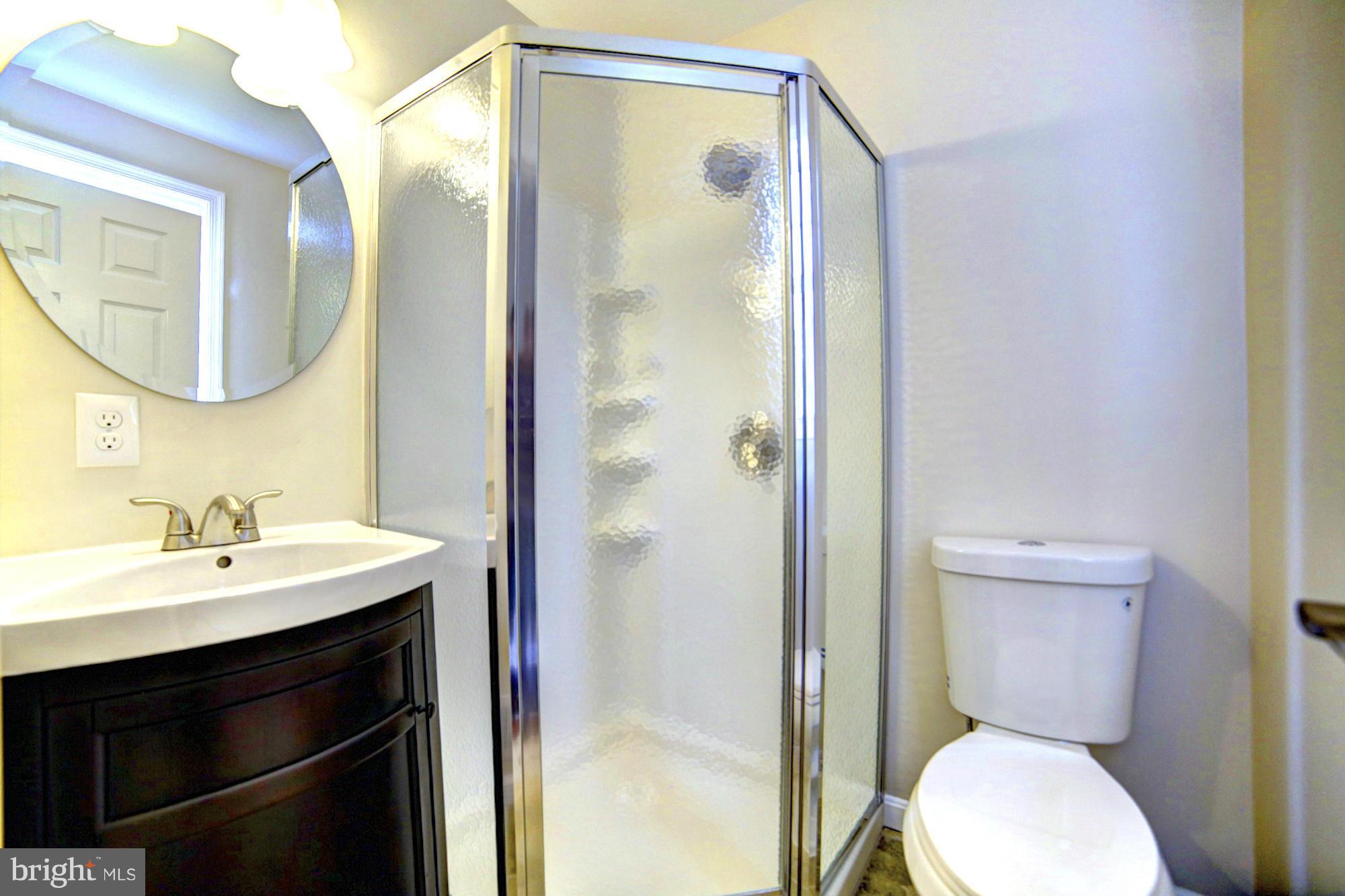 4021 Rouen Road Randallstown, MD 21133 - Photo 10 of 22 a bathroom with a sink toilet and shower