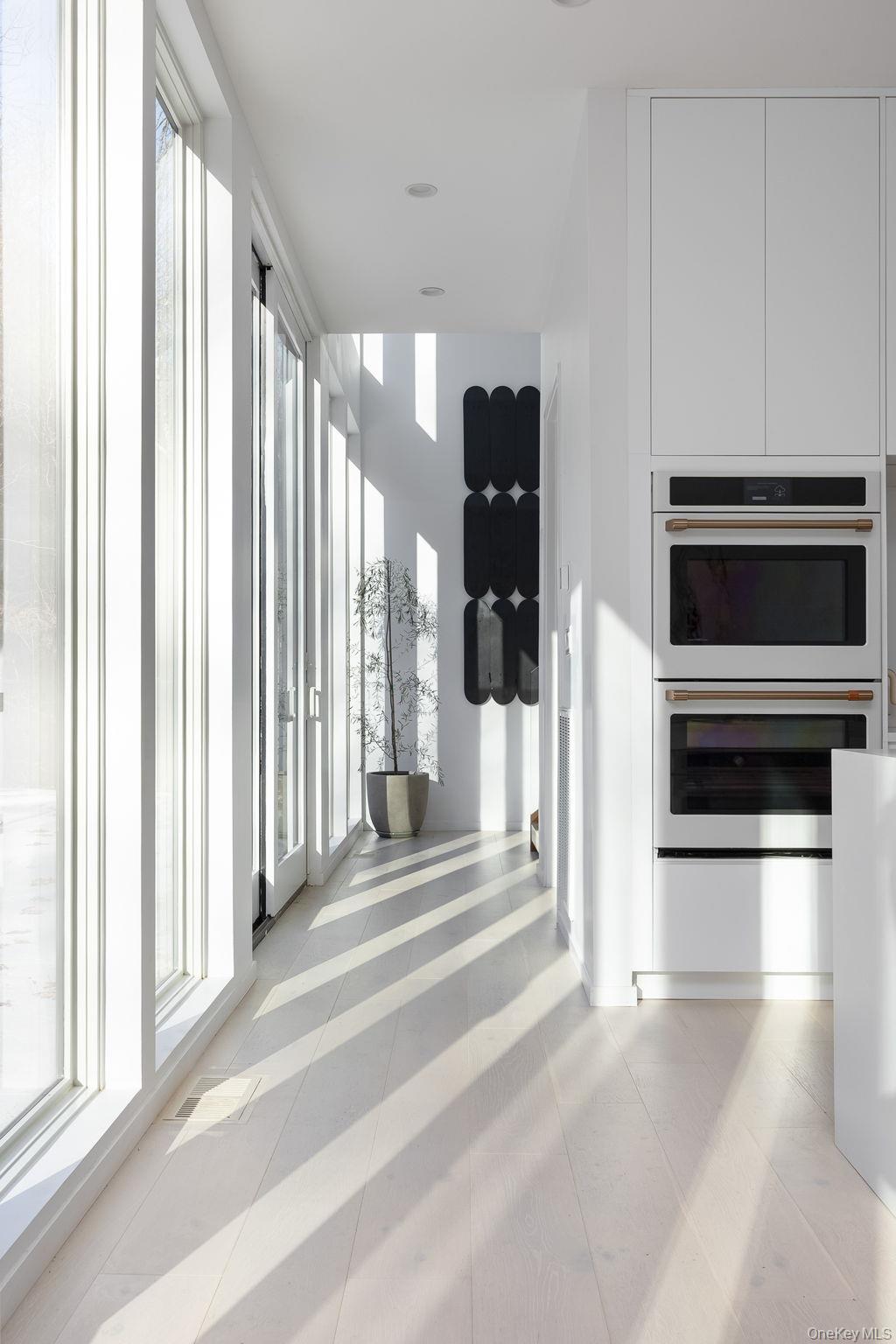 211 Little York Road Warwick, NY 10990 - Photo 12 of 37 a view of a kitchen with a stove and a large window