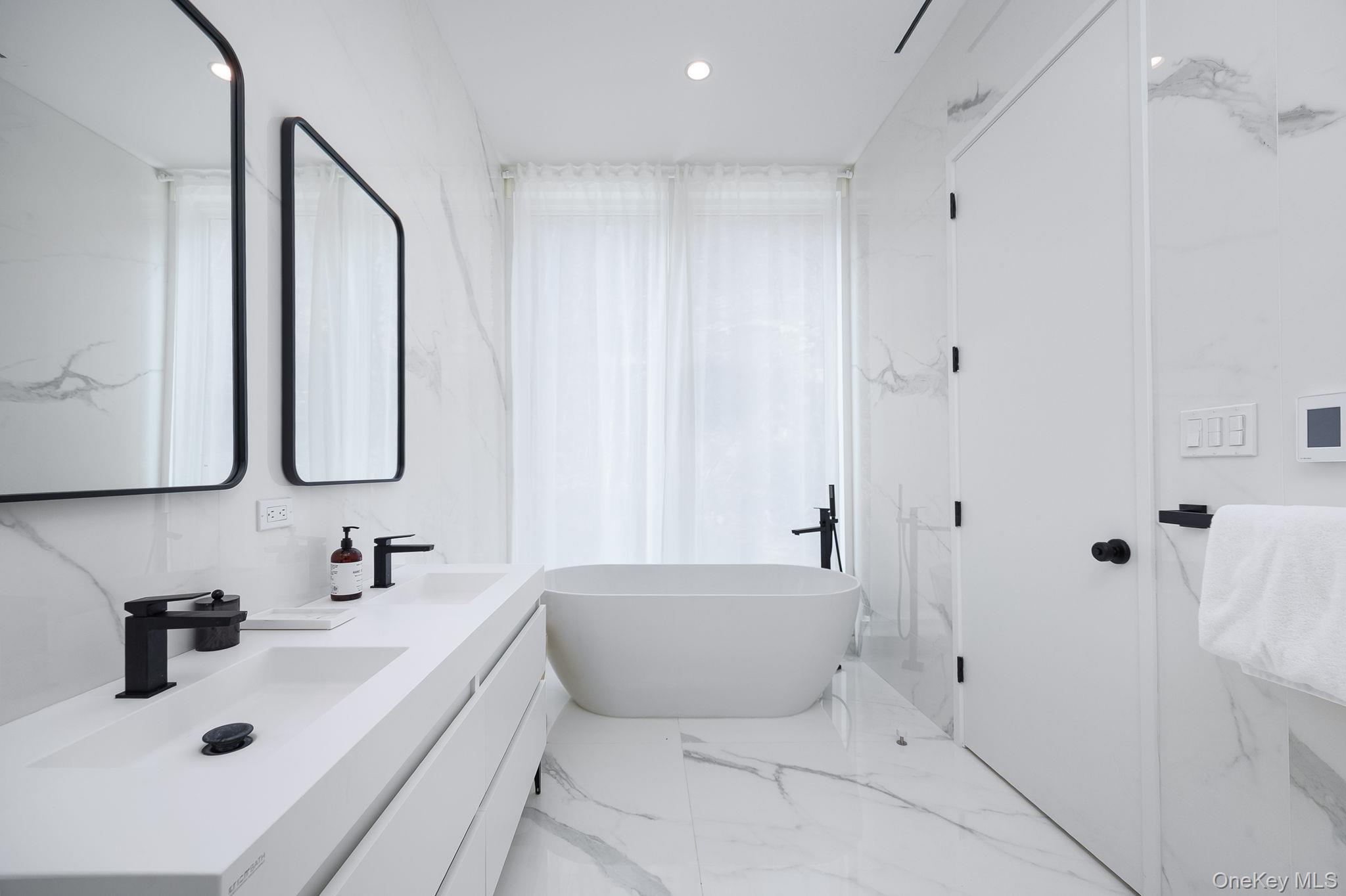 211 Little York Road Warwick, NY 10990 - Photo 20 of 37 a bathroom with a tub sink and mirror