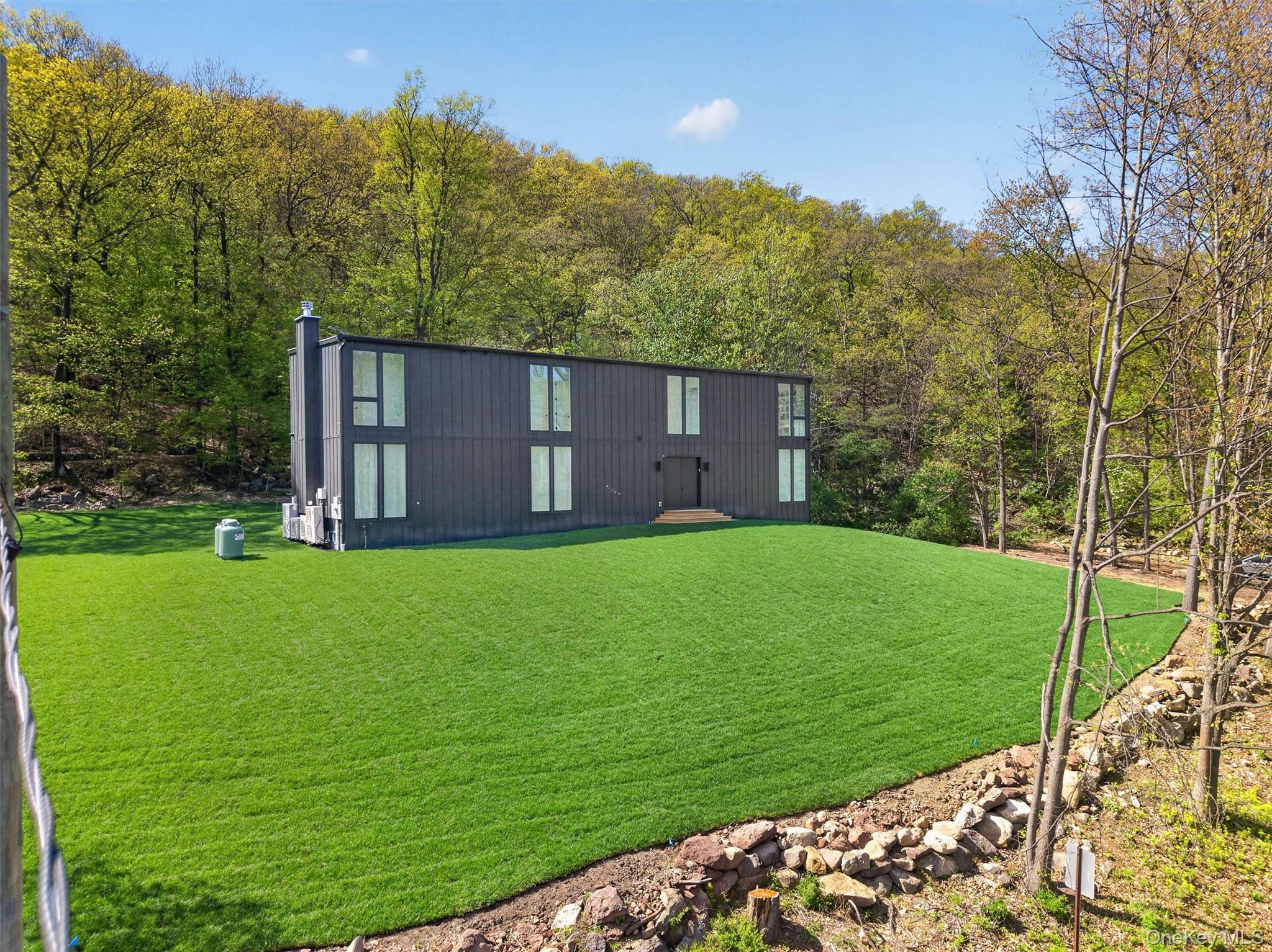 211 Little York Road Warwick, NY 10990 - Photo 2 of 41 a house view with a garden space