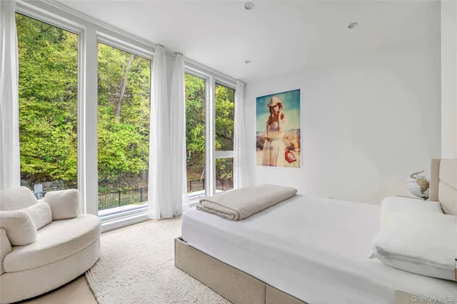 a bathroom with a granite countertop sink a toilet and mirror