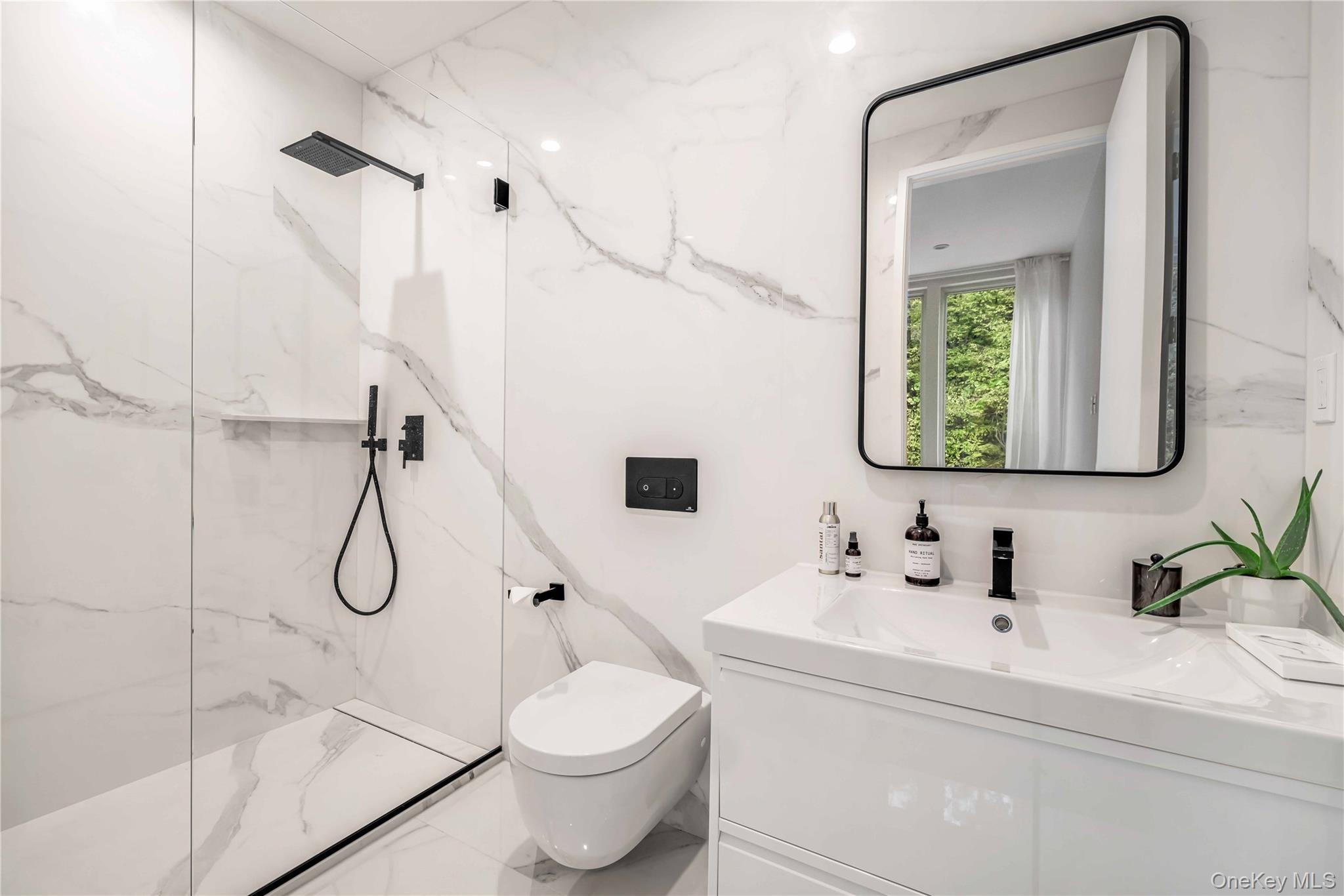 211 Little York Road Warwick, NY 10990 - Photo 22 of 37 a bathroom with a granite countertop sink a toilet and mirror
