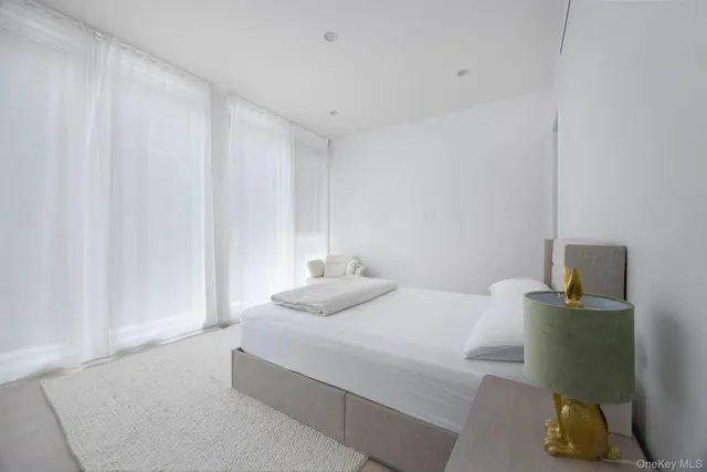 a bathroom with a toilet sink and shower