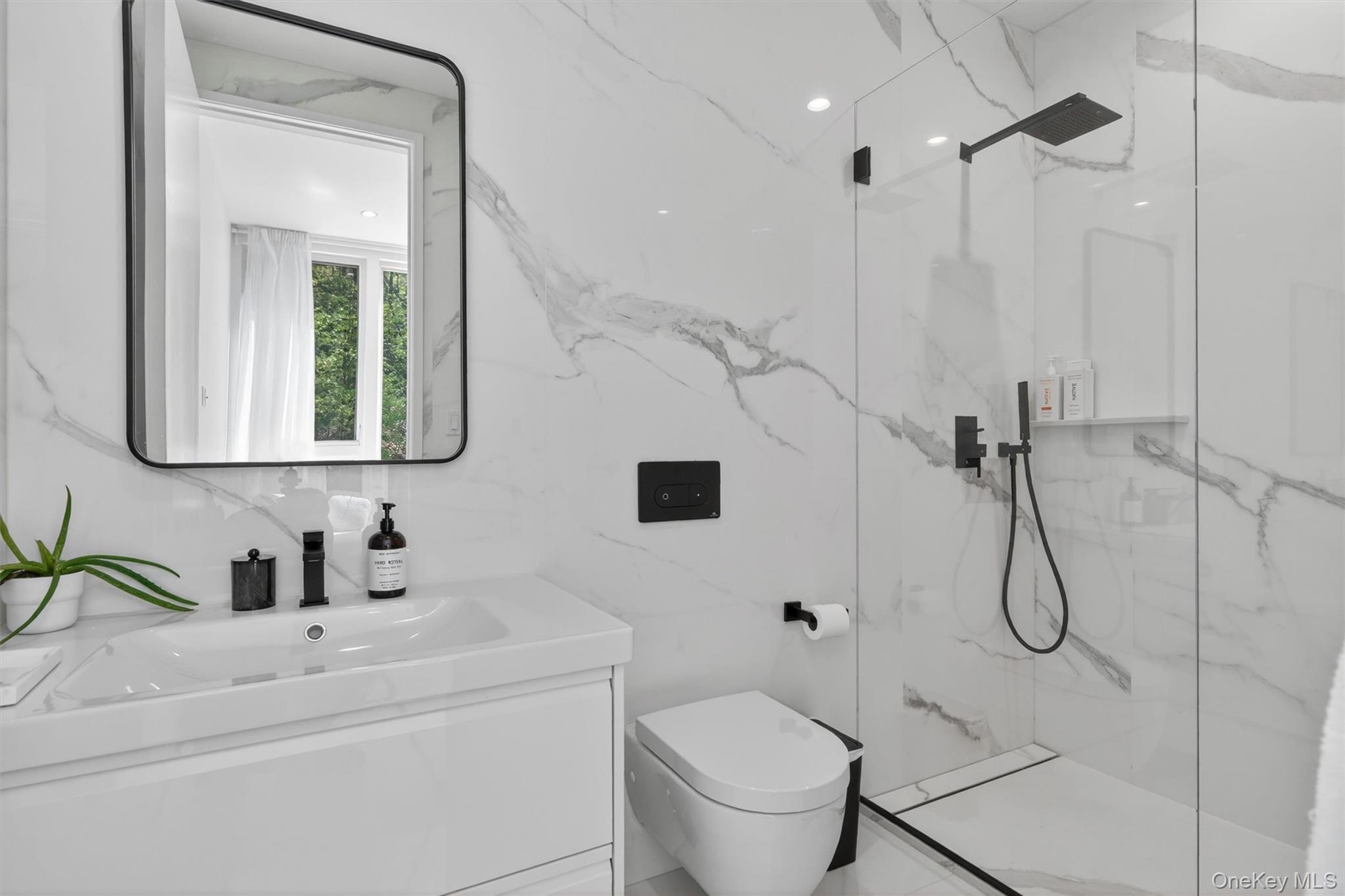 211 Little York Road Warwick, NY 10990 - Photo 26 of 41 a bathroom with a sink a toilet and a mirror