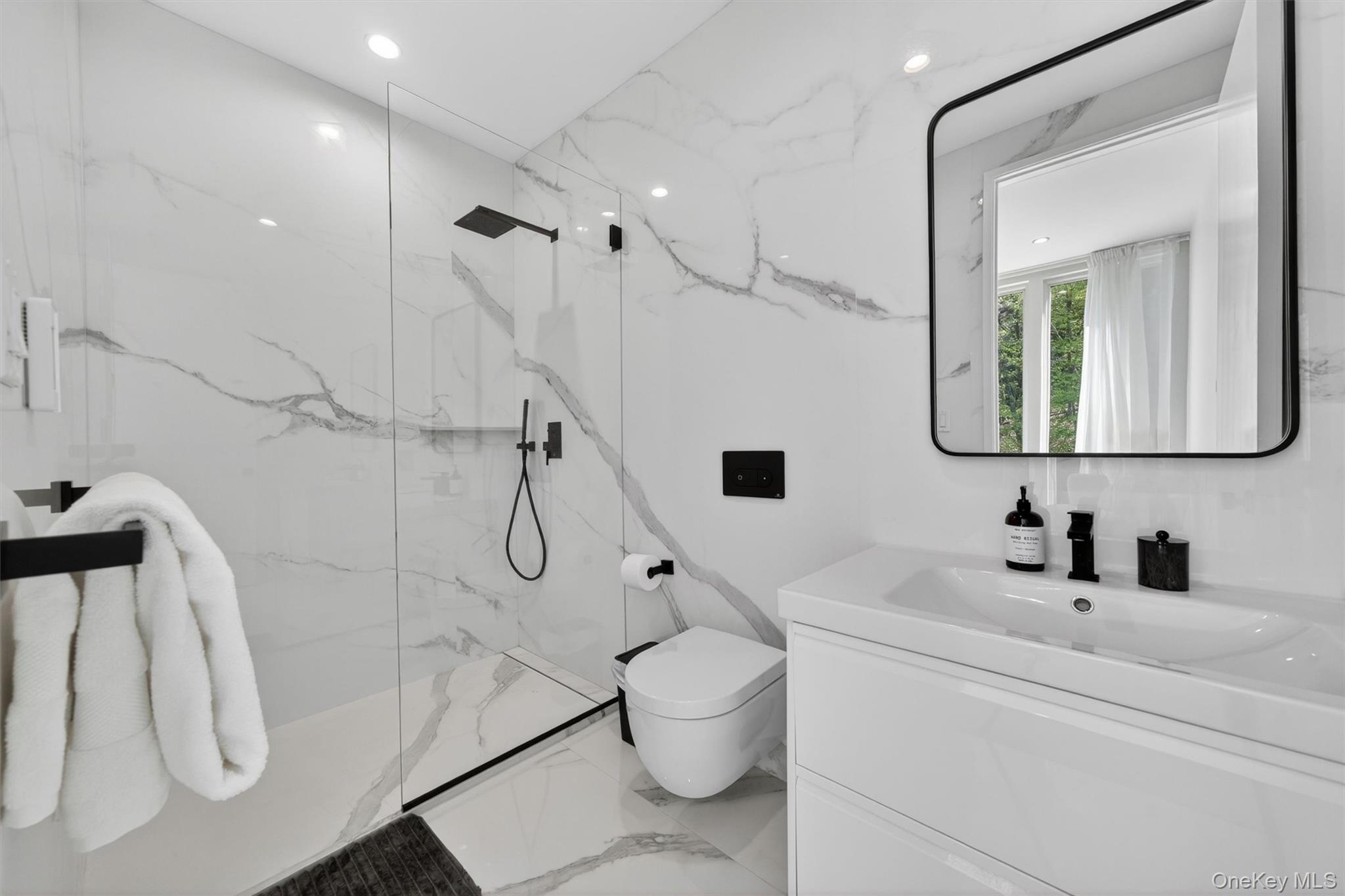 211 Little York Road Warwick, NY 10990 - Photo 29 of 41 a bathroom with a granite countertop sink a toilet and a mirror