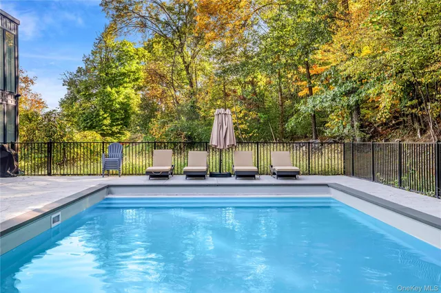 a view of a swimming pool with a patio
