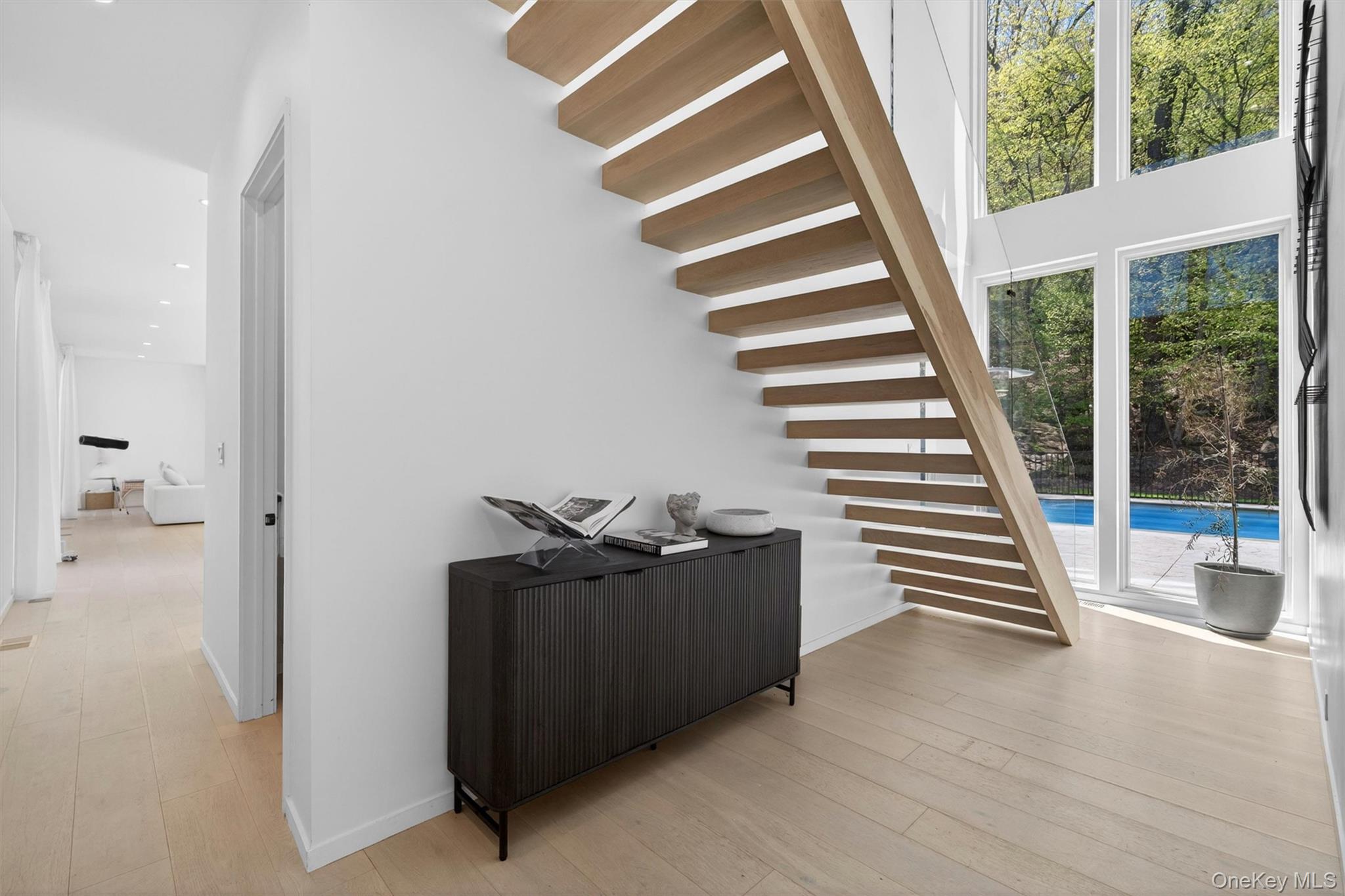 211 Little York Road Warwick, NY 10990 - Photo 5 of 41 a view of a hallway with stairs and wooden floor