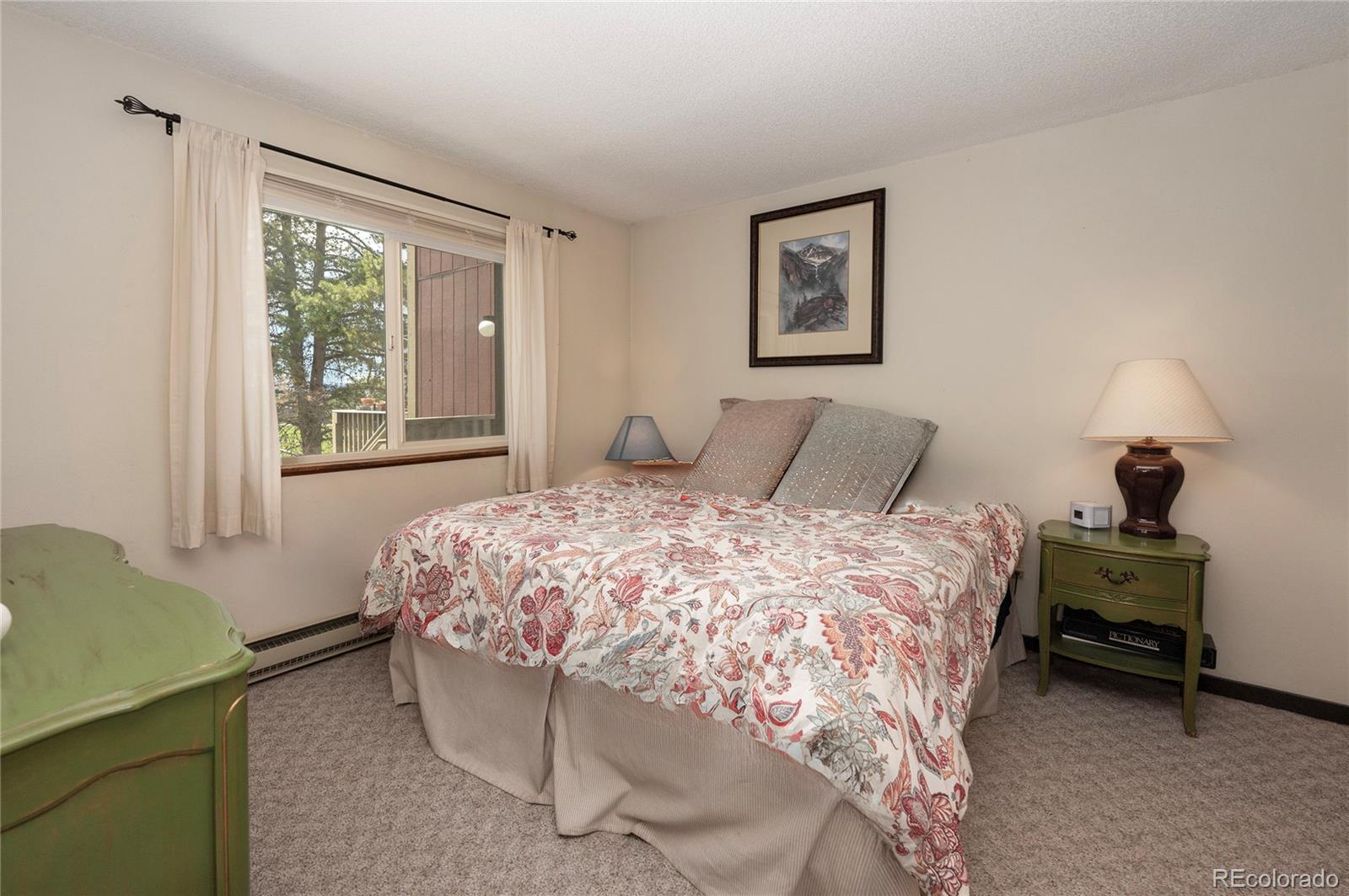 80 Gcr 838/e Meadow, Unit 2211 Fraser, CO 80442 - Photo 10 of 16 a bedroom with a bed chair and window